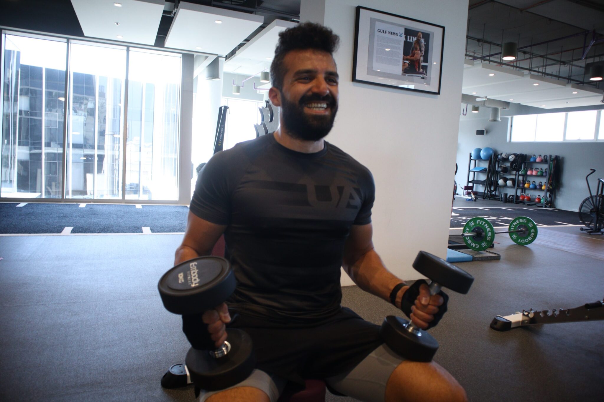 Ahmed, a male is working out with dumbbells