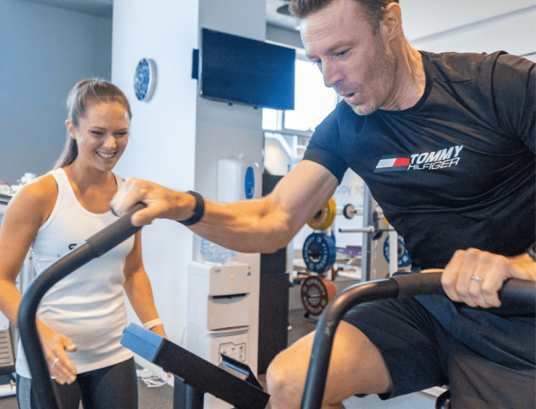 trainer with trainee on bike
