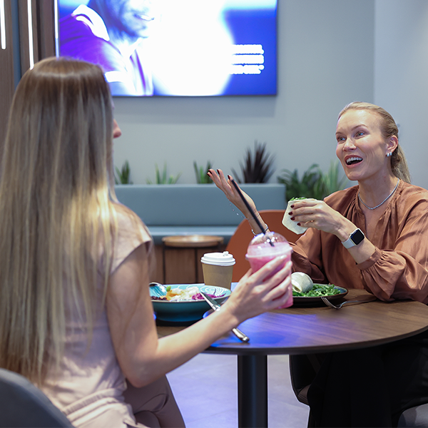 2 women are having a healthy meal at embody