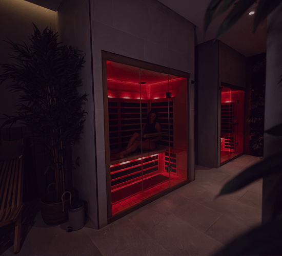 woman sat in infrared sauna